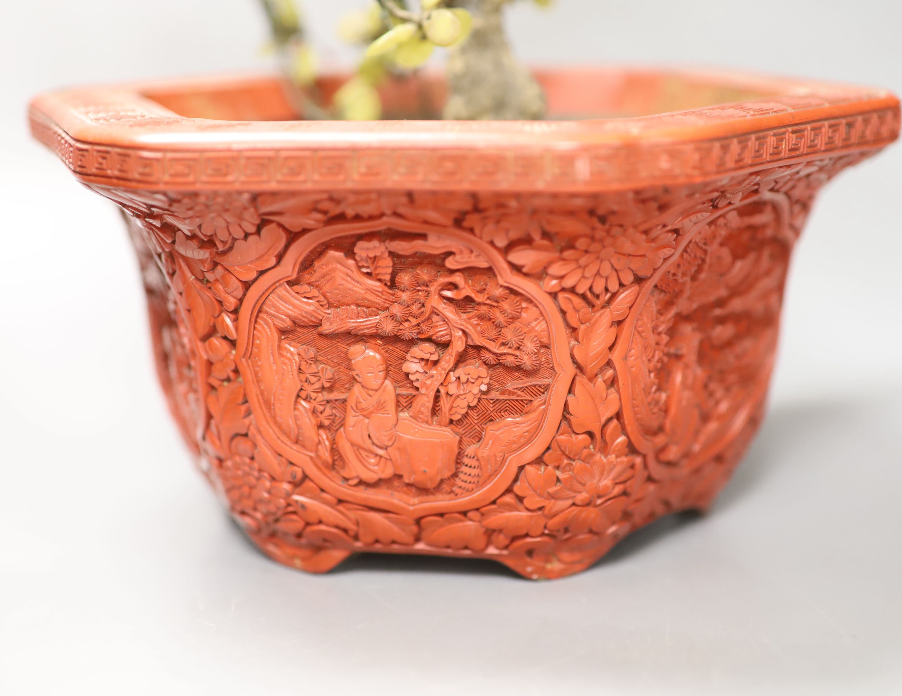 A Chinese hardstone miniature tree in hexagonal cinnabar lacquer jardiniere and a lacquered pewter tea caddy